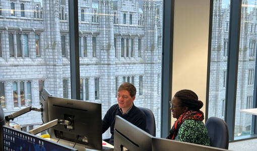 Two of NSTA staff at work in our Aberdeen office